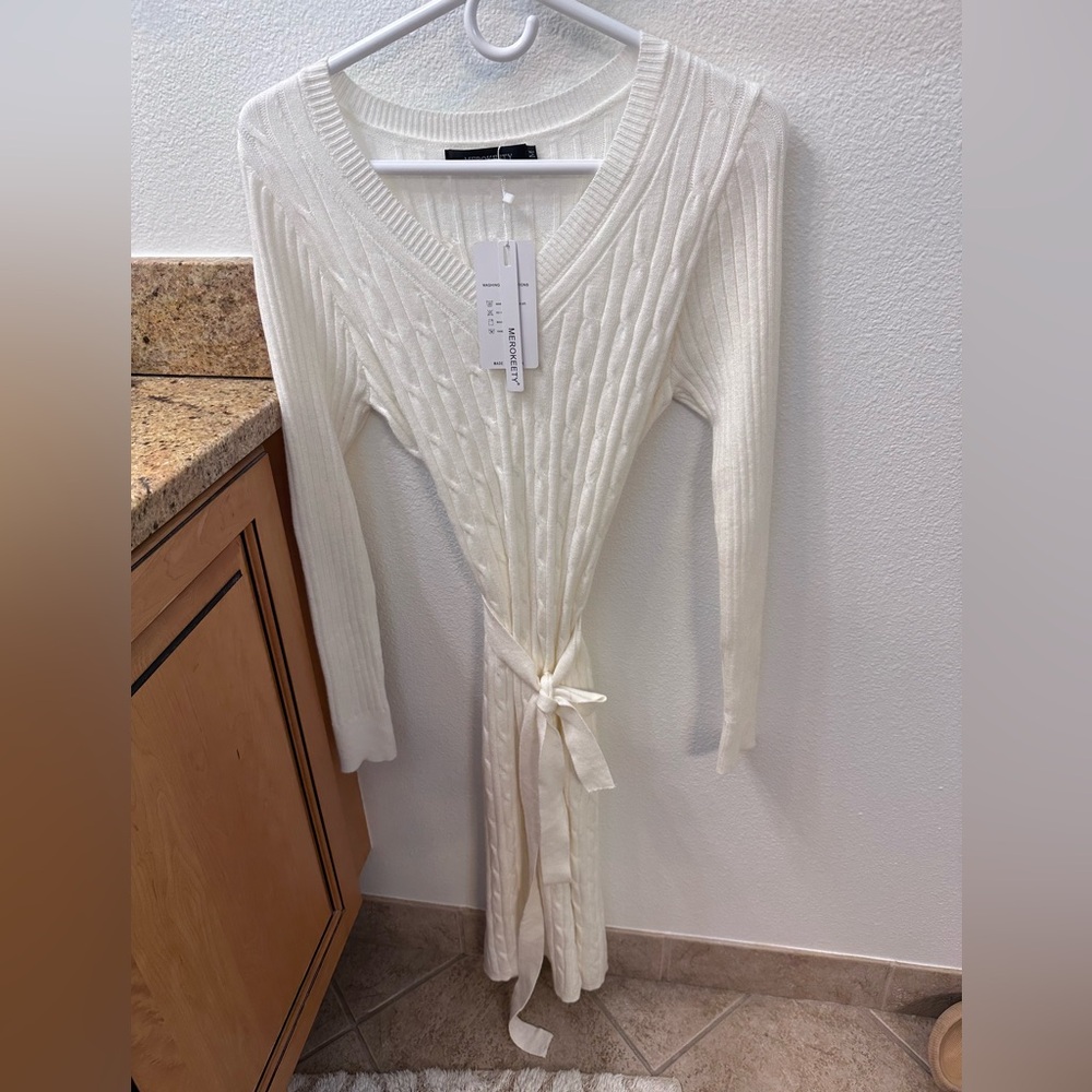 Sweat her Dress in White with slit . Size M